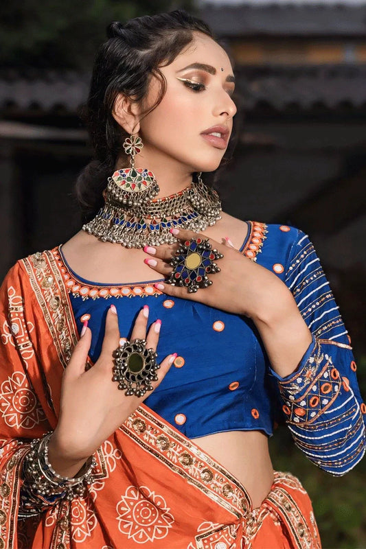 Traditional Heavy Flair Orange Chaniya Choli For Garba